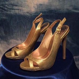 Open toed gold pumps